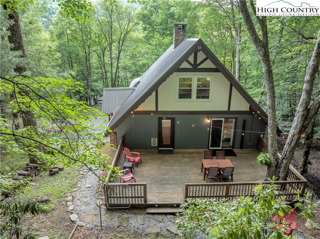 404 Charter Hills Road Beech Mountain, NC 28604 - Photo 36 of 36 a front view of a house with garden