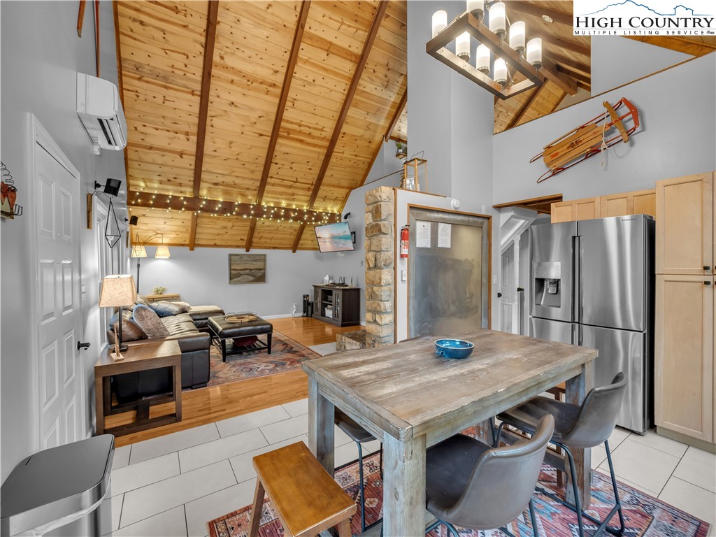 404 Charter Hills Road Beech Mountain, NC 28604 - Photo 8 of 36 a view of a patio with a table and chairs and potted plants