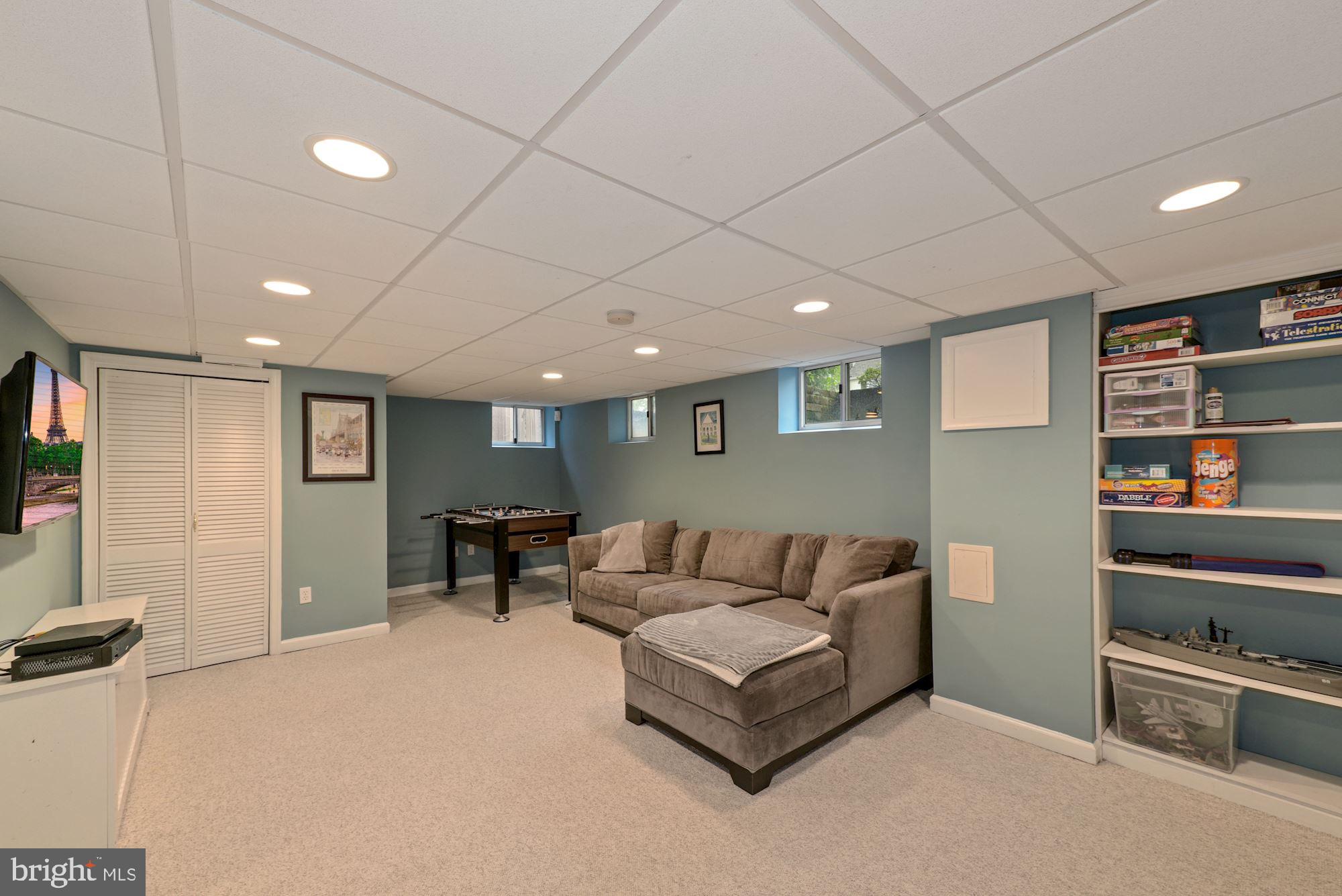 3412 Rittenhouse Street Northwest Washington, DC 20015 - Photo 22 of 33 Lower level recreation room with built-ins