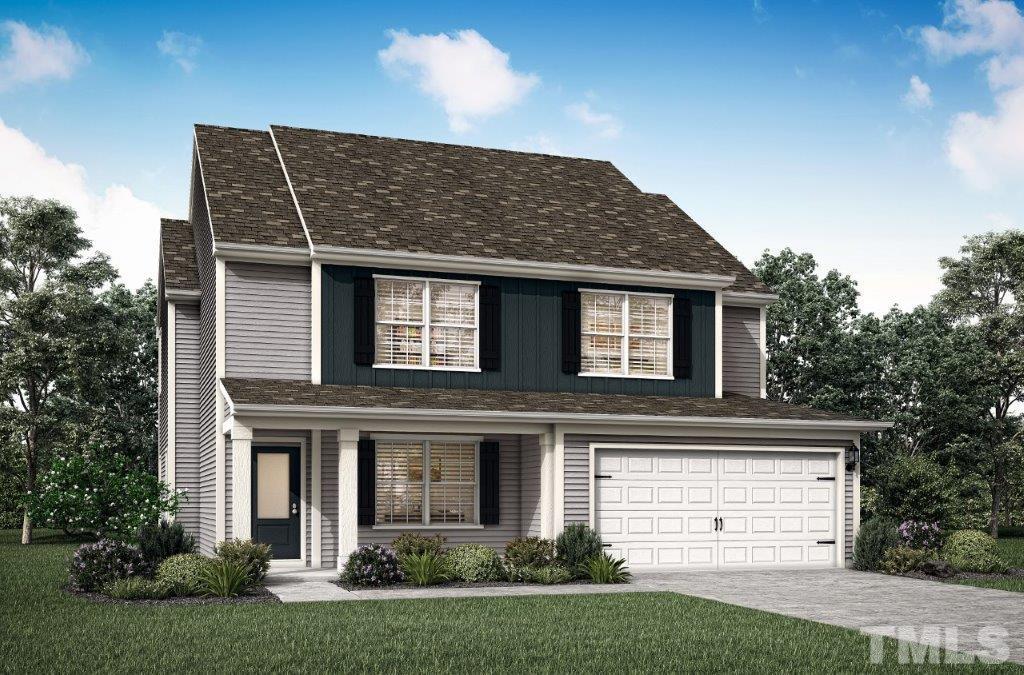 211 Chedworth Drive Angier, NC 27501 - Photo 3 of 3 a front view of a house with a garden