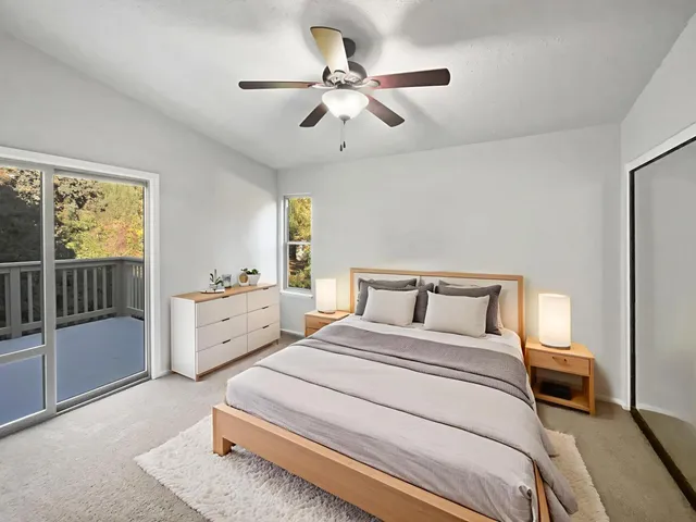 a bed room with a bed and a window