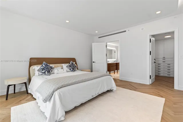 a bedroom with a bed and a table