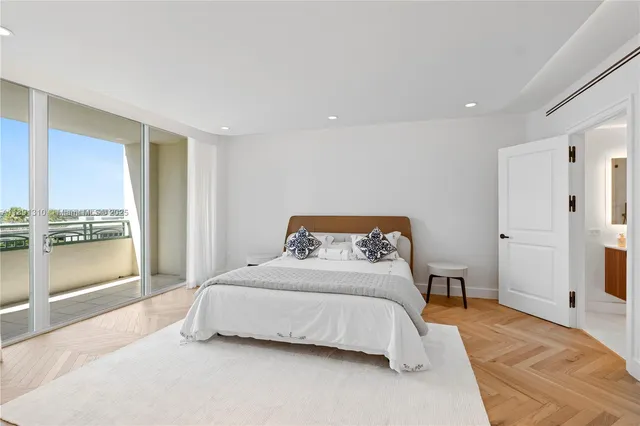 a bedroom with a bed and large closet