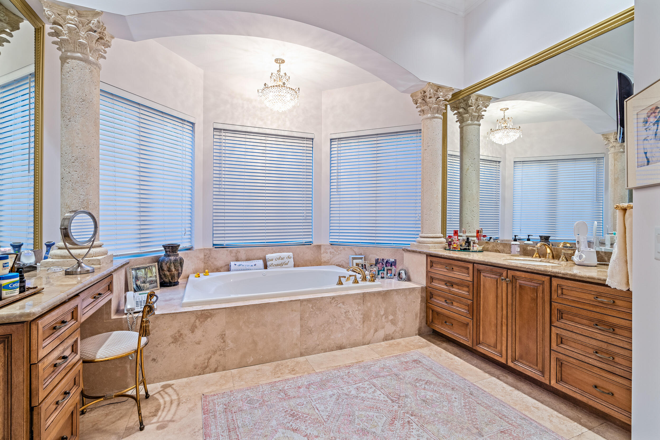 19010 Loxahatchee River Road Jupiter, FL 33458 - Photo 12 of 38 a bathroom with a tub sink and mirror