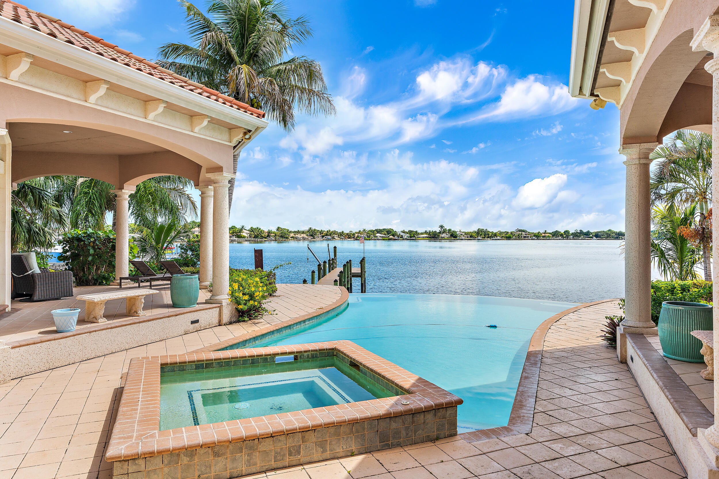 19010 Loxahatchee River Road Jupiter, FL 33458 - Photo 14 of 38 a terrace with outdoor seating and city view
