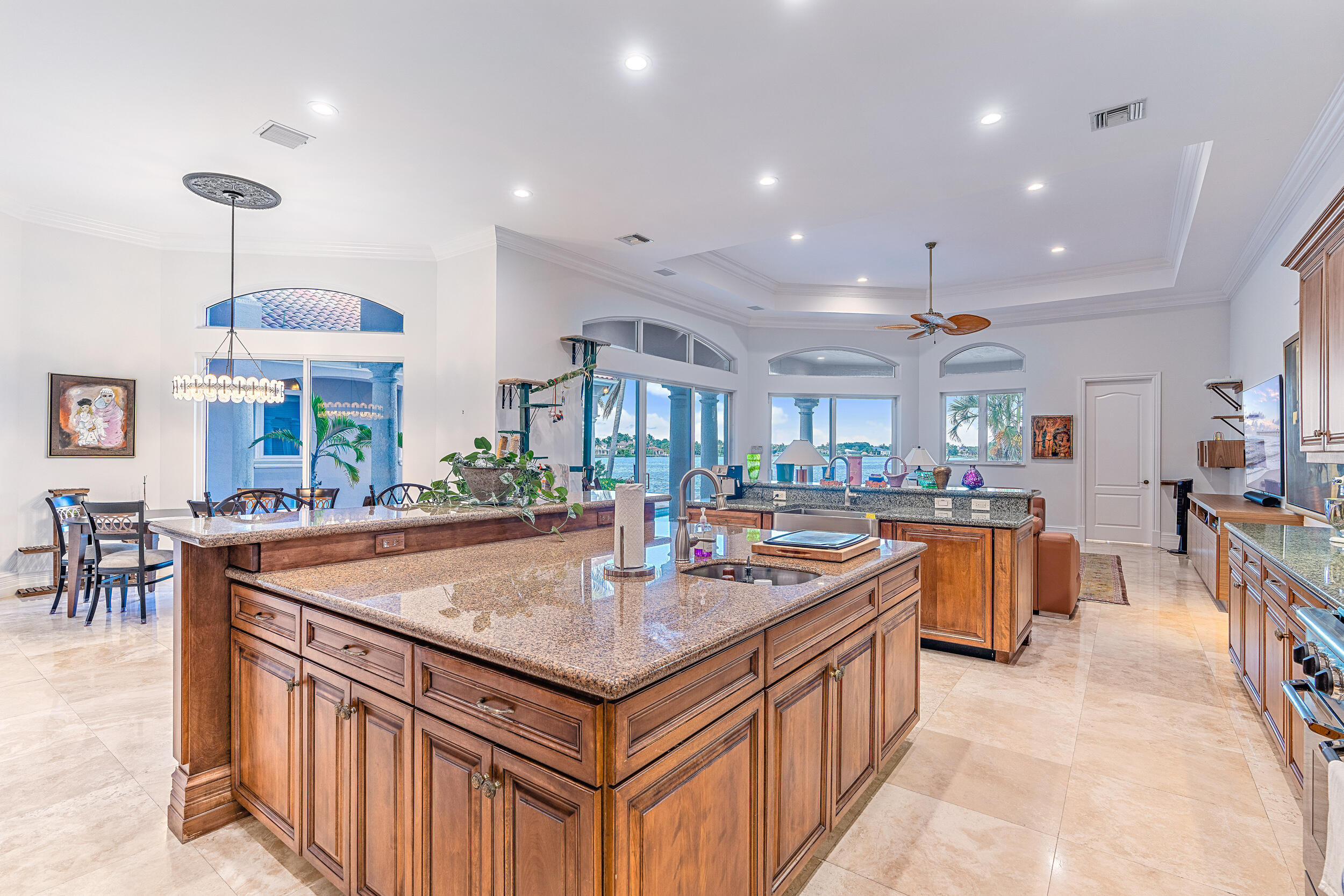 19010 Loxahatchee River Road Jupiter, FL 33458 - Photo 16 of 38 a kitchen with stainless steel appliances granite countertop a stove and a sink