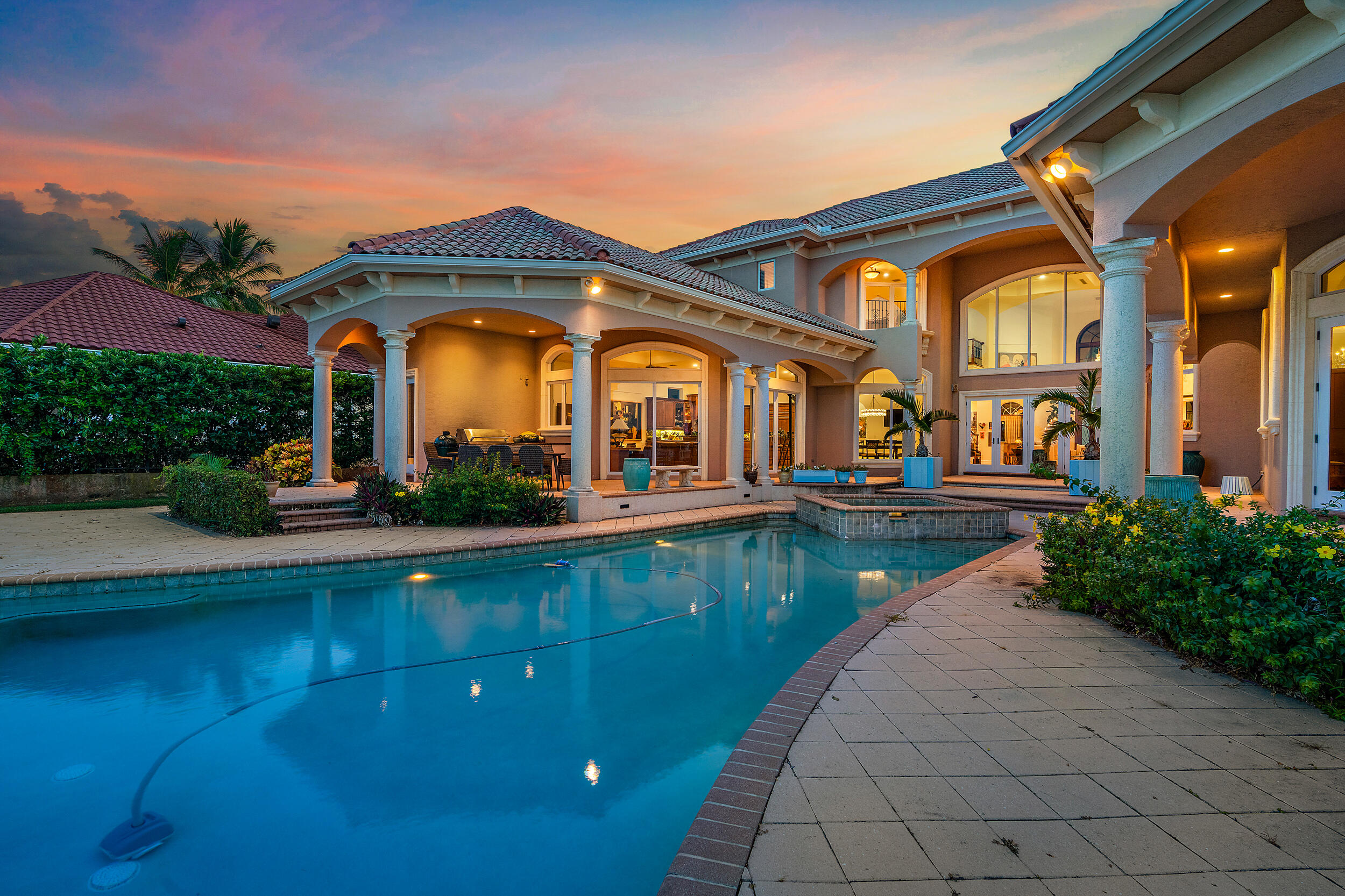 19010 Loxahatchee River Road Jupiter, FL 33458 - Photo 20 of 38 a view of a building with a garden