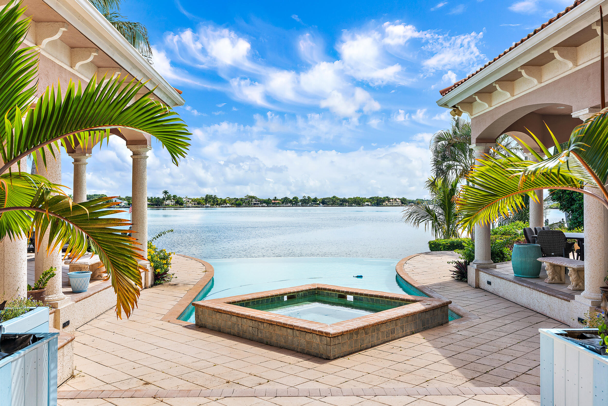 19010 Loxahatchee River Road Jupiter, FL 33458 - Photo 33 of 38 a view of a lake with couches and wooden floor