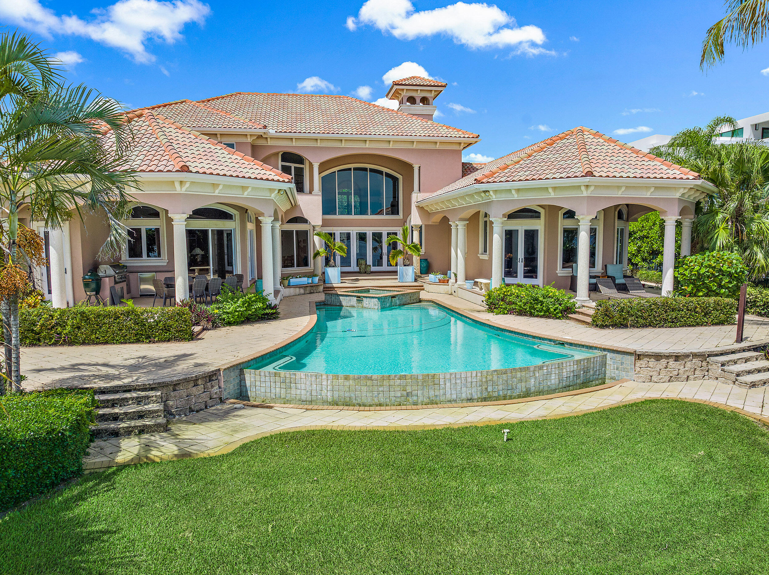 19010 Loxahatchee River Road Jupiter, FL 33458 - Photo 38 of 38 a front view of a house with a yard table and chairs