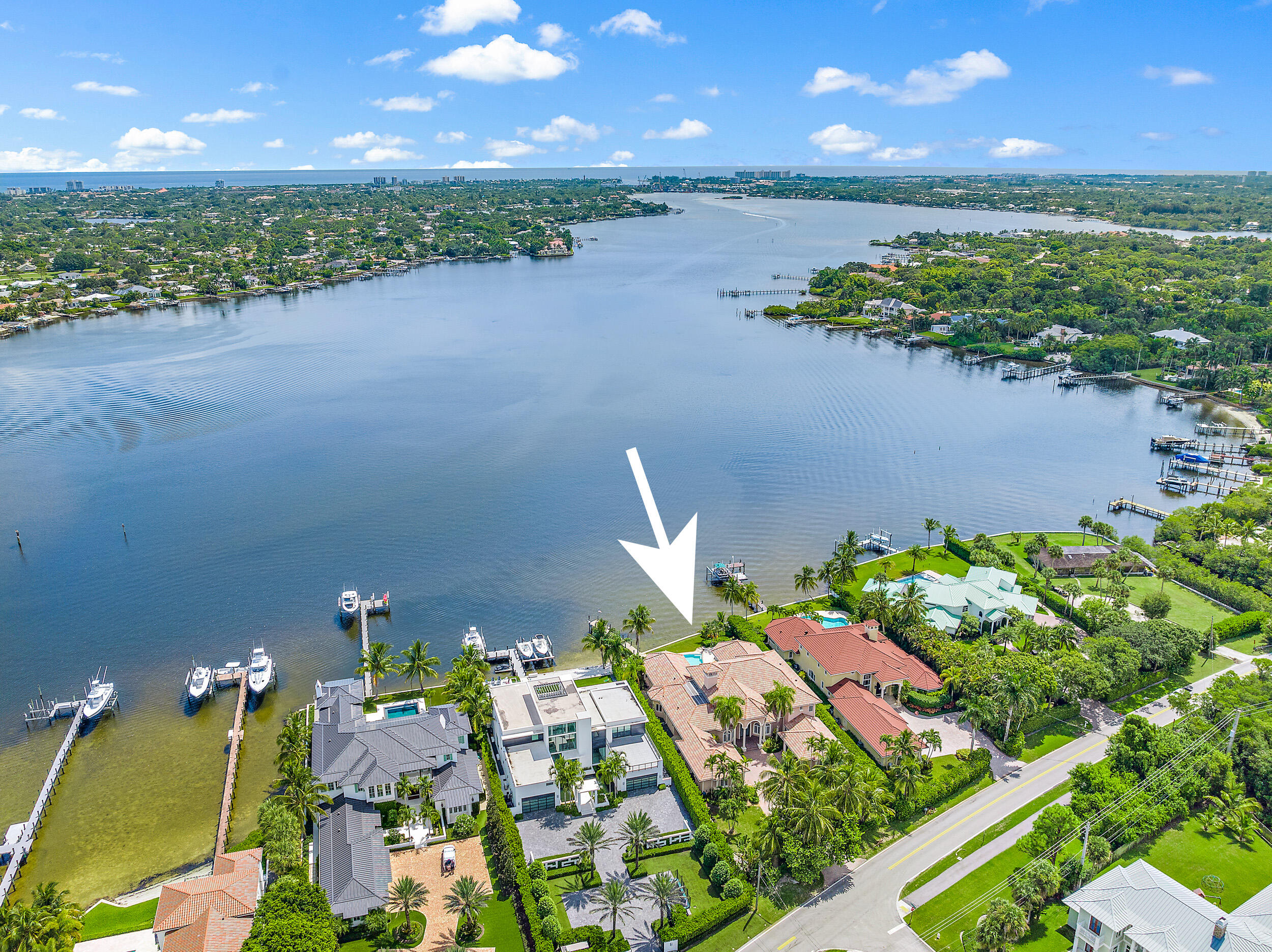 19010 Loxahatchee River Road Jupiter, FL 33458 - Photo 5 of 38 an aerial view of a house with a yard and lake view