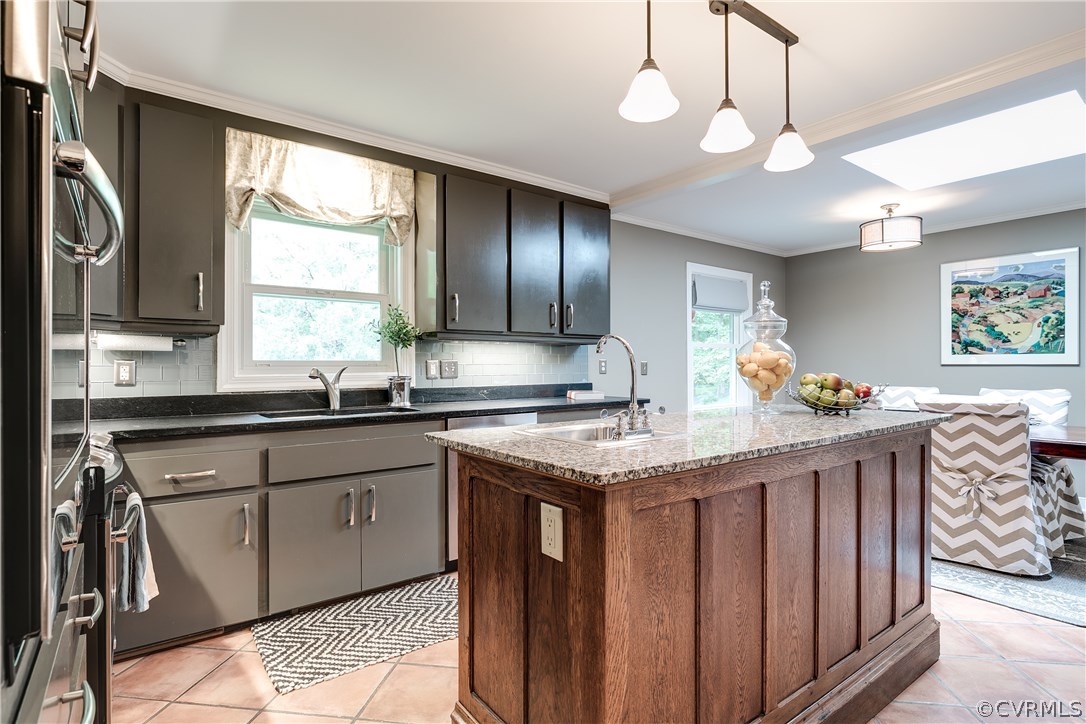3801 East Old Gun Road Midlothian, VA 23113 - Photo 9 of 27 a kitchen with stainless steel appliances granite countertop a sink a stove cabinets counter space and a window