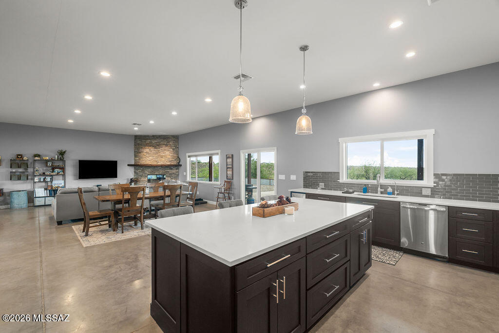 16276 East Empire View Road Vail, AZ 85641 - Photo 19 of 51 a kitchen with a stove a counter top space and living room view