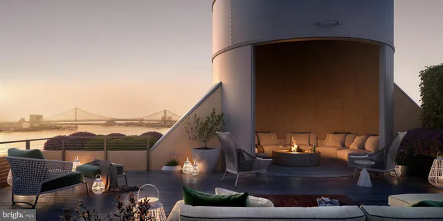 a view of a balcony with furniture and a floor to ceiling window