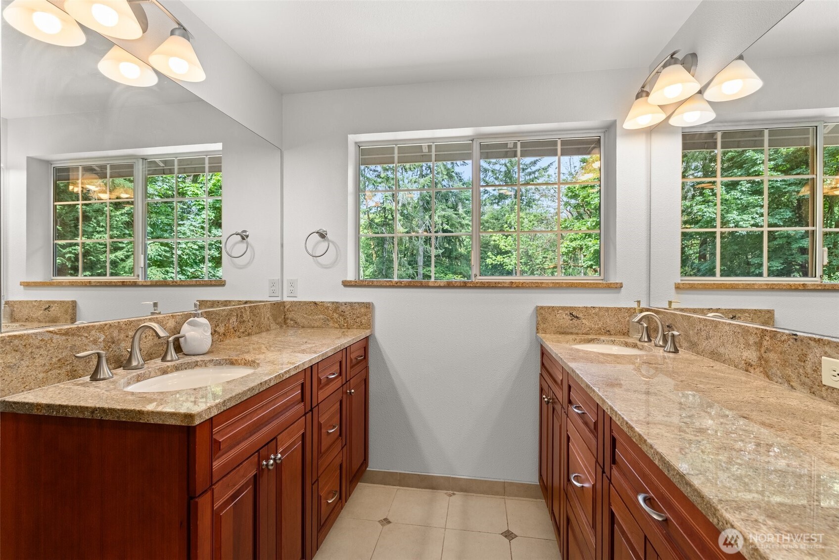 6333 Boardman Road Northwest Olympia, WA 98502 - Photo 20 of 38 a bathroom with a granite countertop sink and a large window