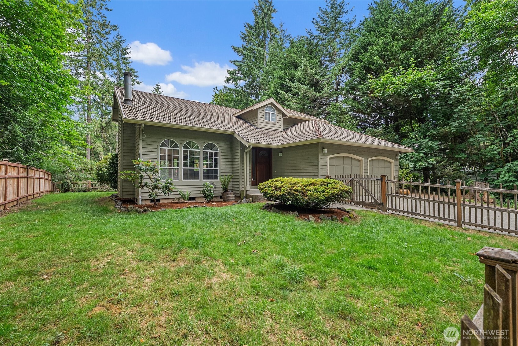 6333 Boardman Road Northwest Olympia, WA 98502 - Photo 37 of 38 a view of a house with backyard and porch