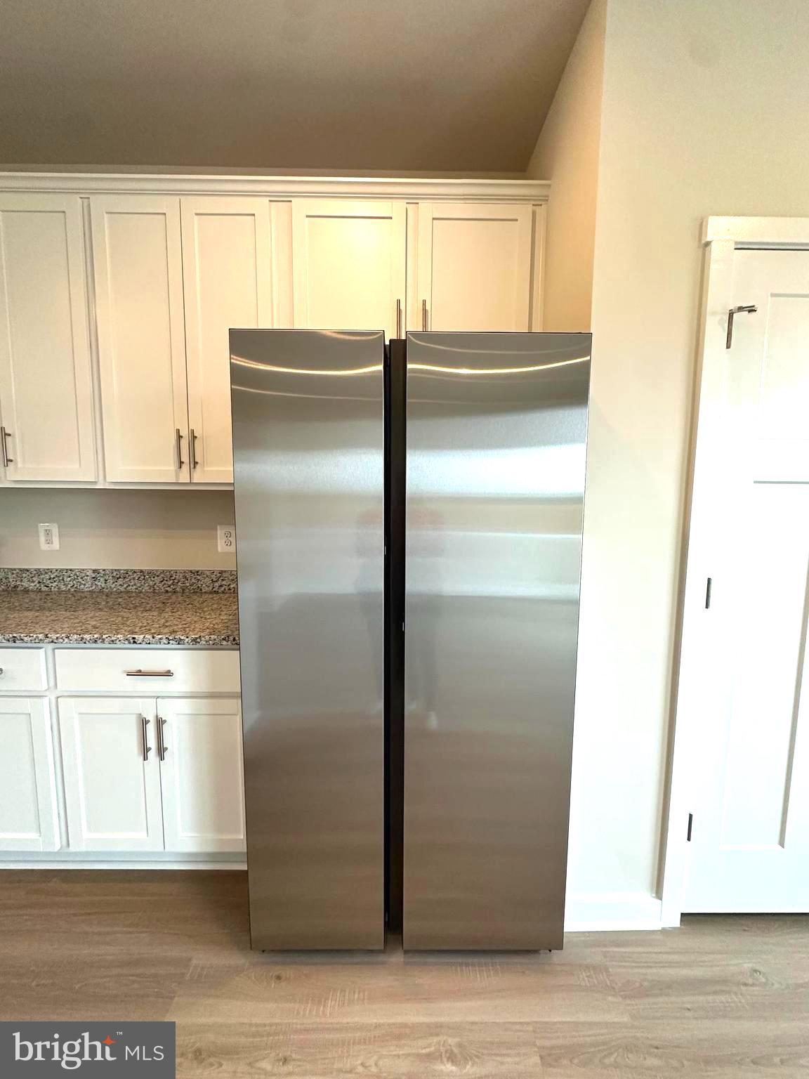 369 Huntwell W Avenue Ranson, WV 25438 - Photo 20 of 41 a kitchen with a refrigerator and window