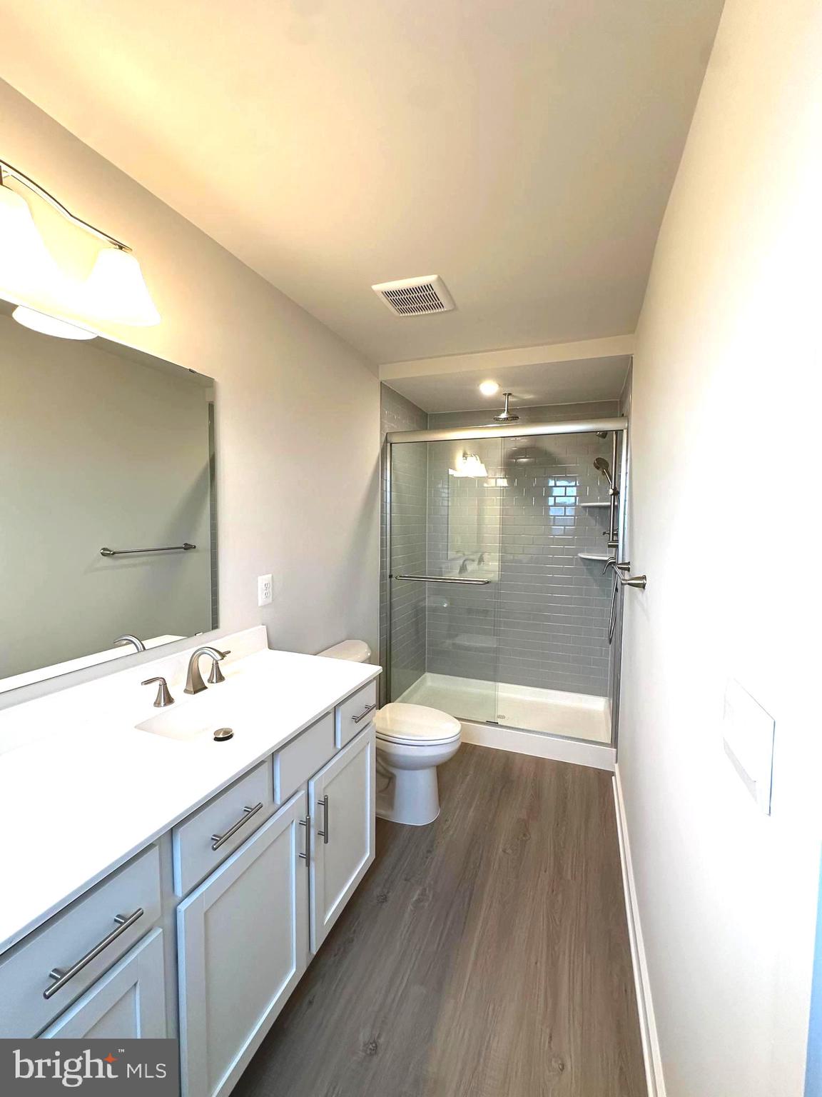 369 Huntwell W Avenue Ranson, WV 25438 - Photo 33 of 41 a bathroom with a sink a toilet and shower
