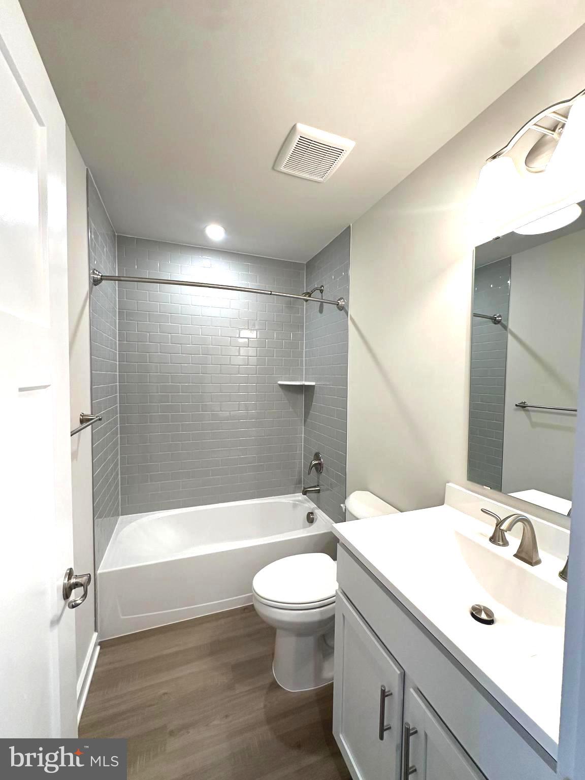 369 Huntwell W Avenue Ranson, WV 25438 - Photo 37 of 41 a bathroom with a bathtub shower sink vanity and toilet