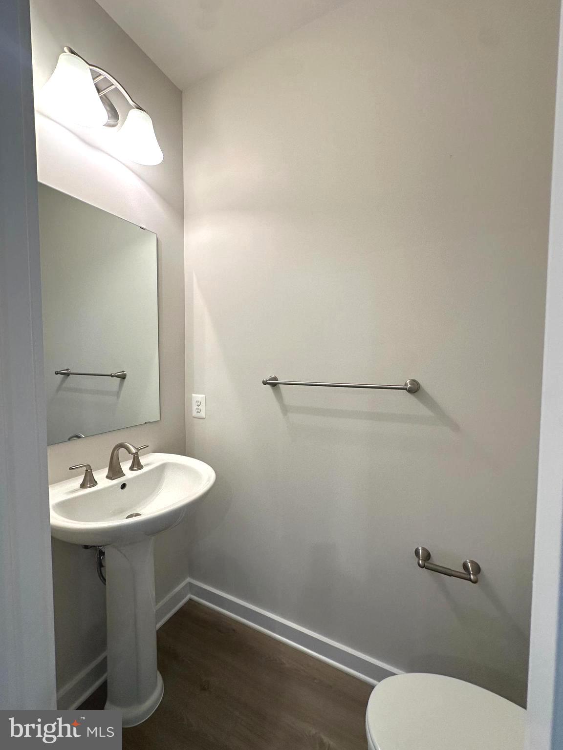 369 Huntwell W Avenue Ranson, WV 25438 - Photo 9 of 41 a bathroom with a sink mirror and toilet