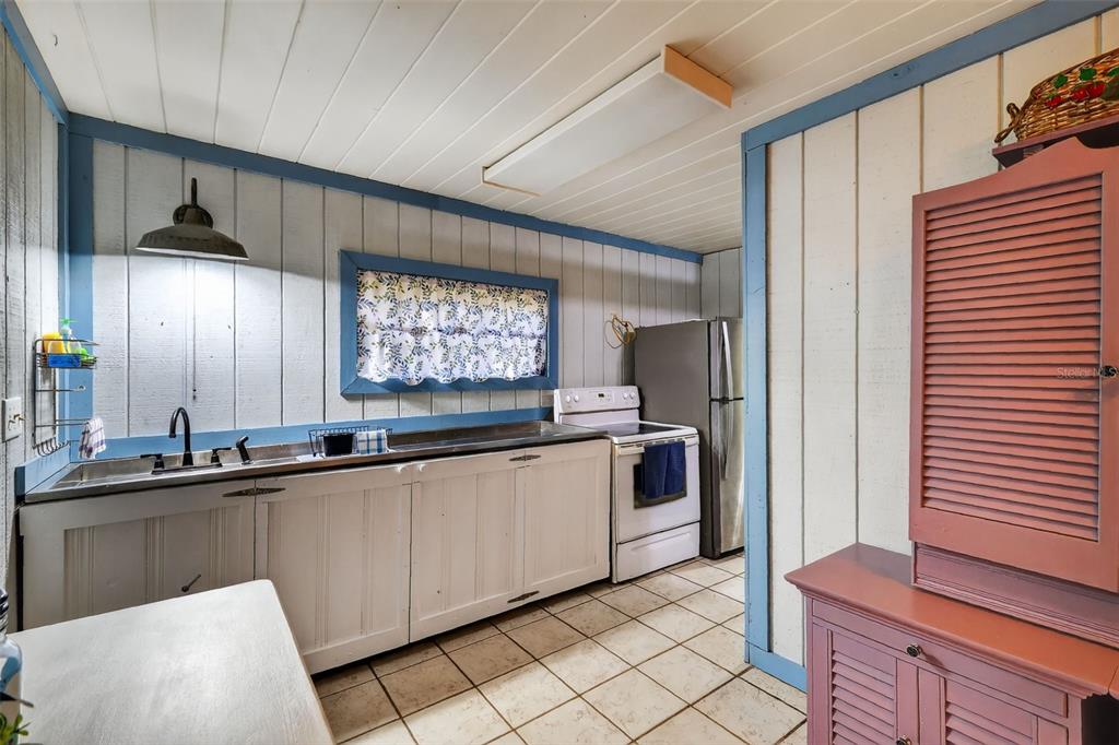 8481 Cr 636 Bushnell Bushnell, FL 33513 - Photo 11 of 25 a kitchen with stainless steel appliances a sink and a refrigerator
