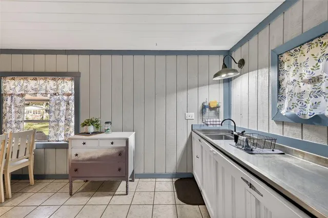a kitchen with a sink and cabinets