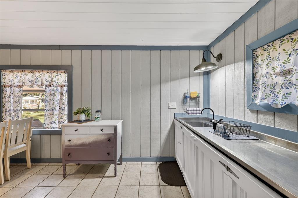 8481 Cr 636 Bushnell Bushnell, FL 33513 - Photo 13 of 25 a kitchen with a sink and cabinets