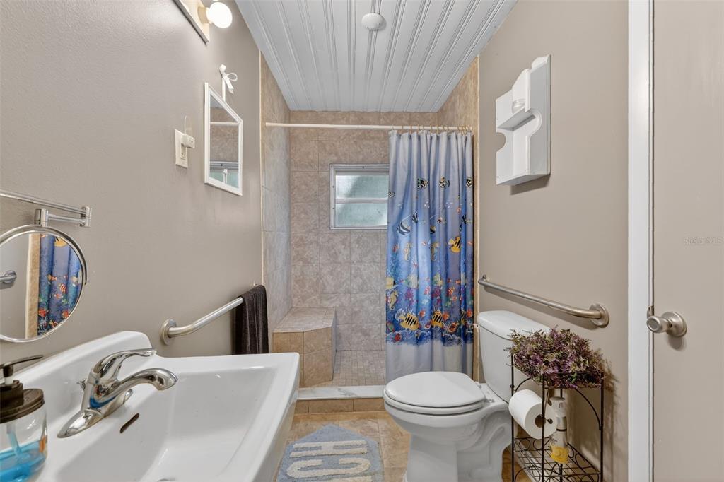 8481 Cr 636 Bushnell Bushnell, FL 33513 - Photo 18 of 25 a bathroom with a sink toilet and shower