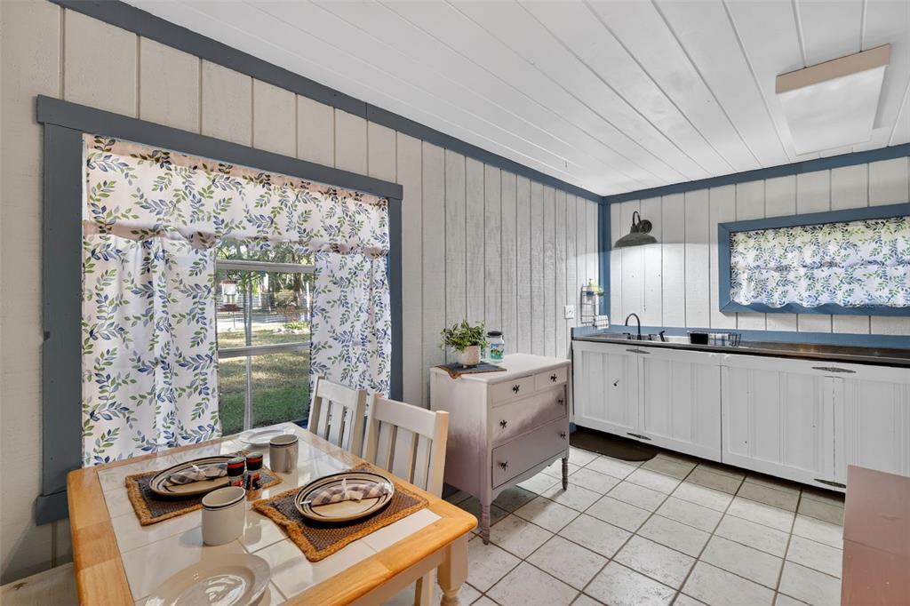 8481 Cr 636 Bushnell Bushnell, FL 33513 - Photo 10 of 25 a kitchen with stainless steel appliances granite countertop a stove a sink and a refrigerator