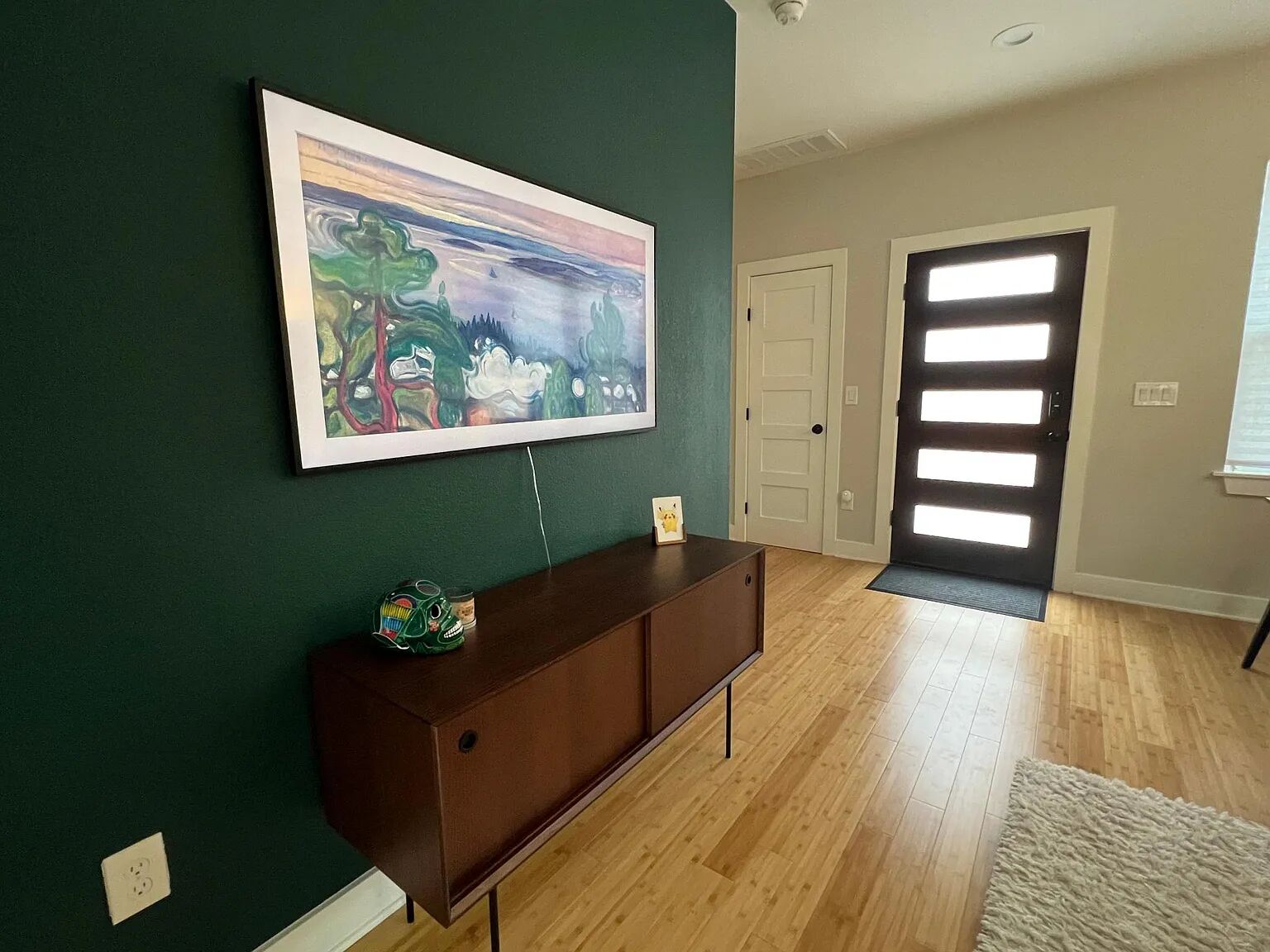 5711 Tura Lane, Unit B Austin, TX 78721 - Photo 2 of 9 a living room with furniture and wooden floor