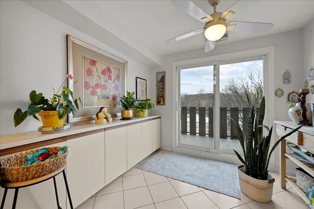 a living room with furniture potted plant and a window