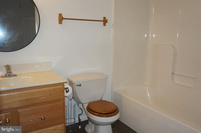 a bathroom with a sink a toilet and a bathtub