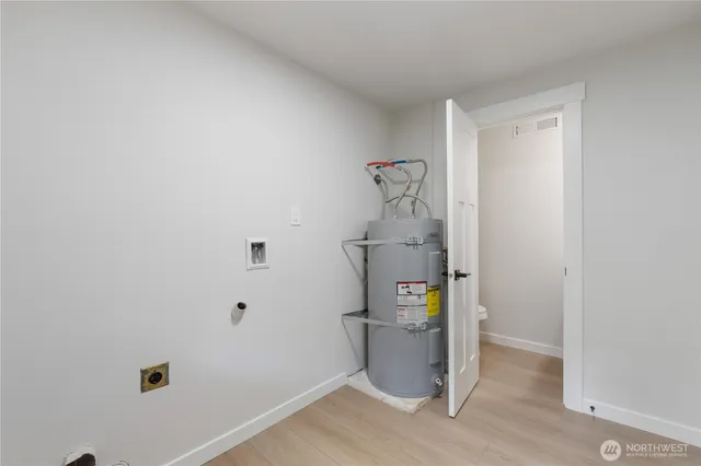 a view of hallway with wooden floor