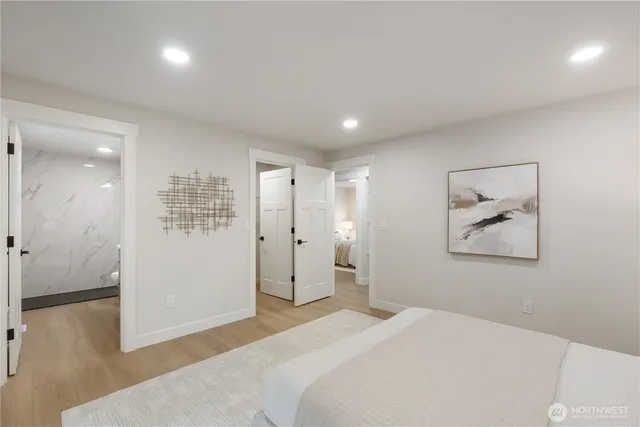 a bedroom with a bed and hallway