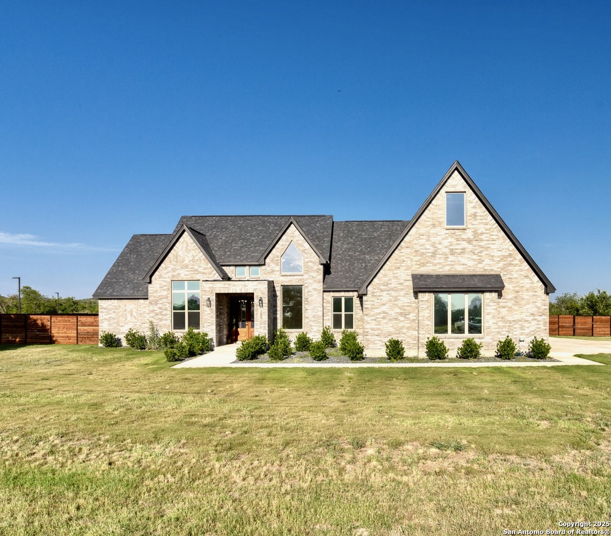 187 Stone Loop Castroville, TX 78009 - Photo 1 of 30 a front view of house with yard