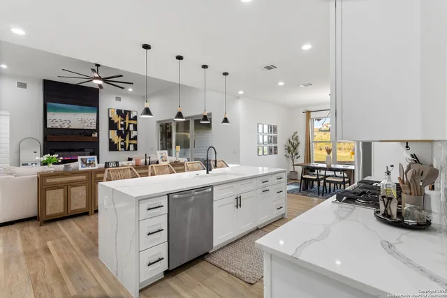 a kitchen with a sink stove and cabinets