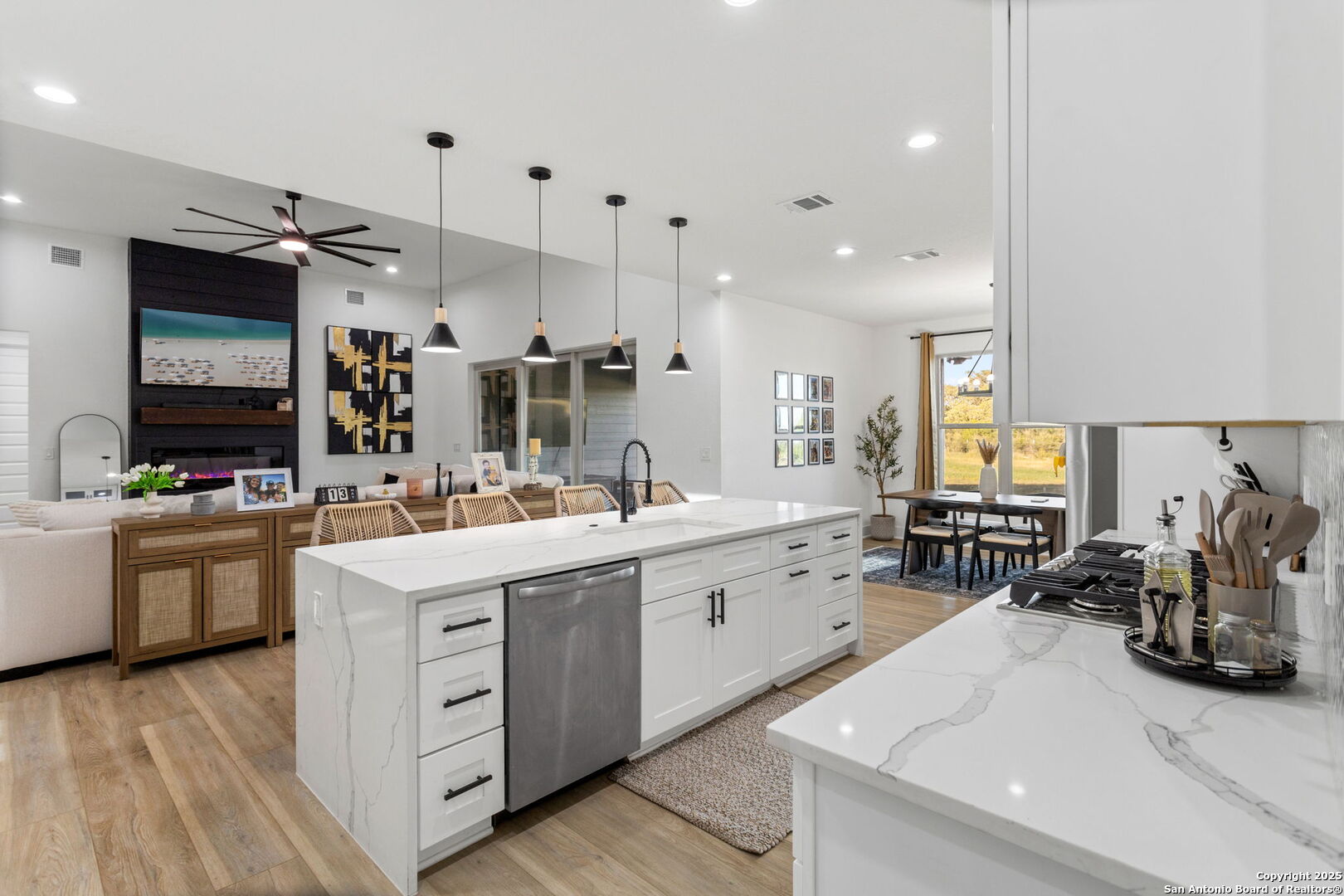 187 Stone Loop Castroville, TX 78009 - Photo 13 of 30 a kitchen with a sink stove and cabinets