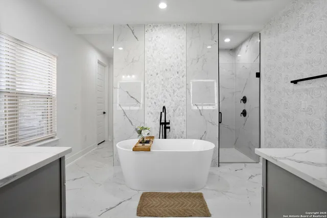 a bathroom with a bathtub and a sink