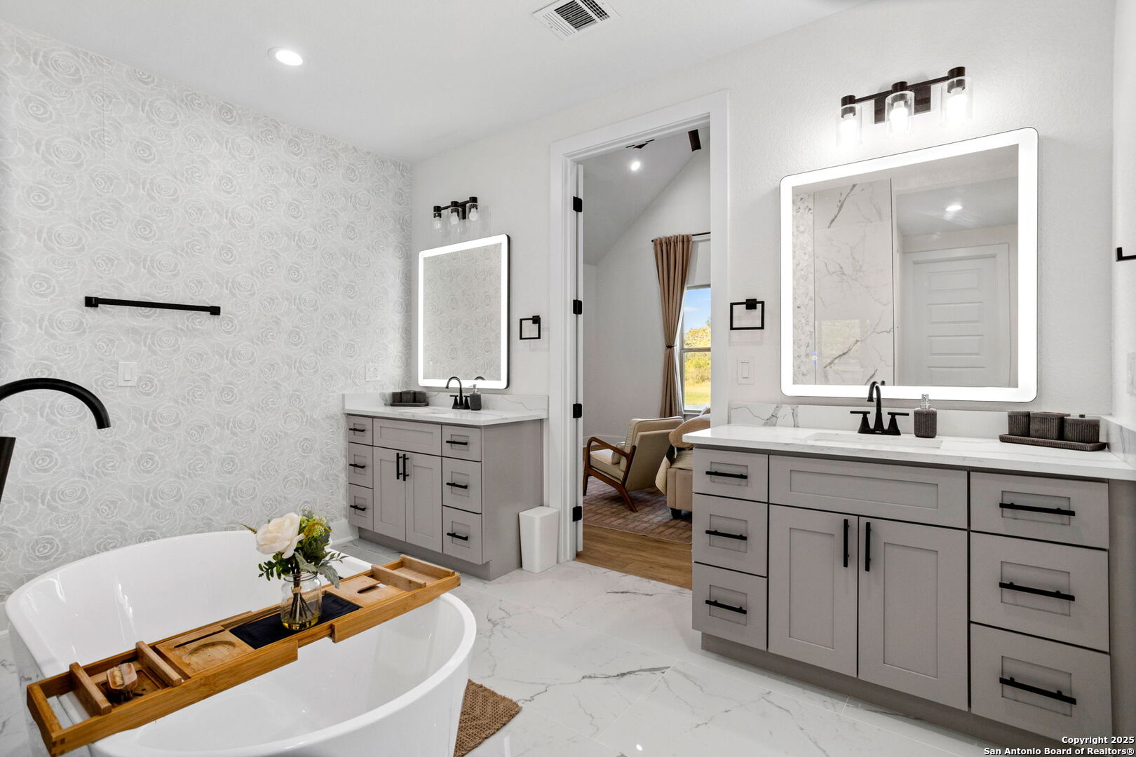 187 Stone Loop Castroville, TX 78009 - Photo 20 of 30 a bathroom with a tub sink and mirror