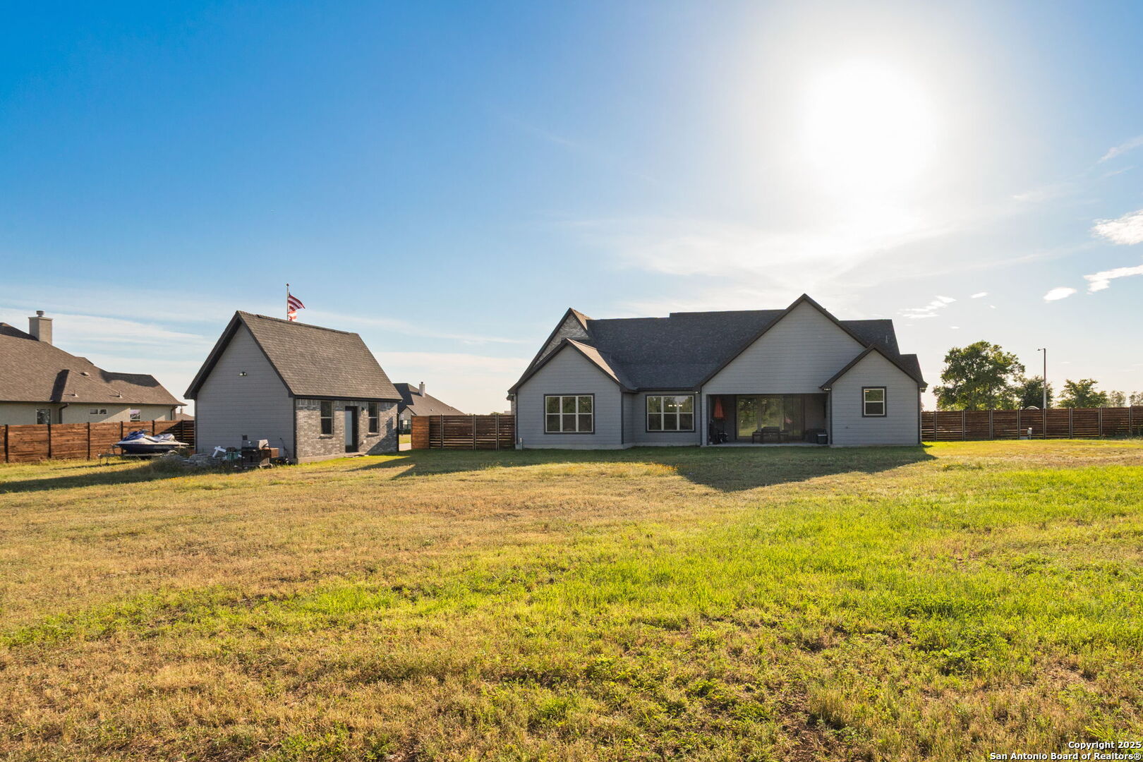 187 Stone Loop Castroville, TX 78009 - Photo 27 of 30 a big house with large trees in front of it