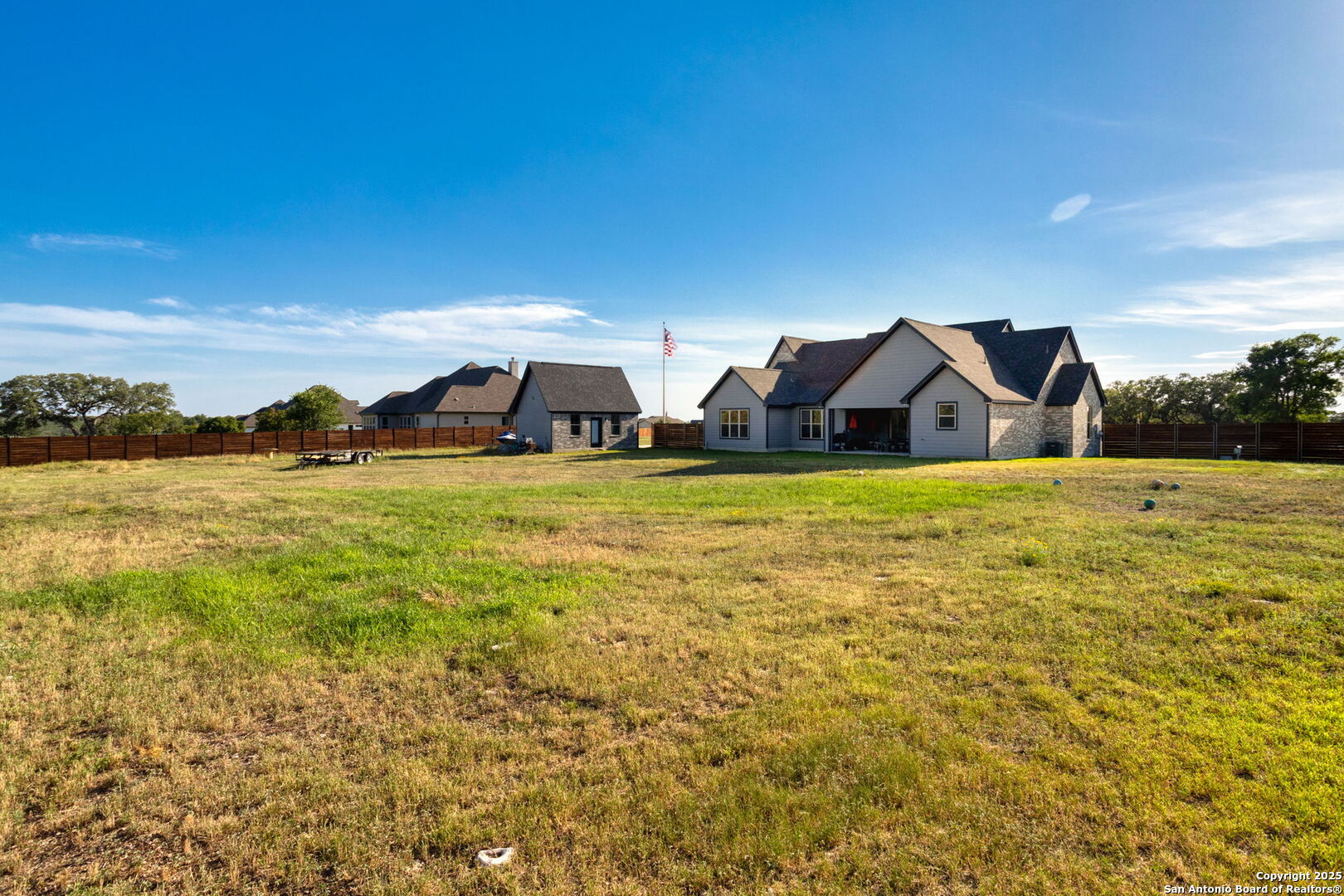 187 Stone Loop Castroville, TX 78009 - Photo 29 of 30 a view of a lake with a house in the background