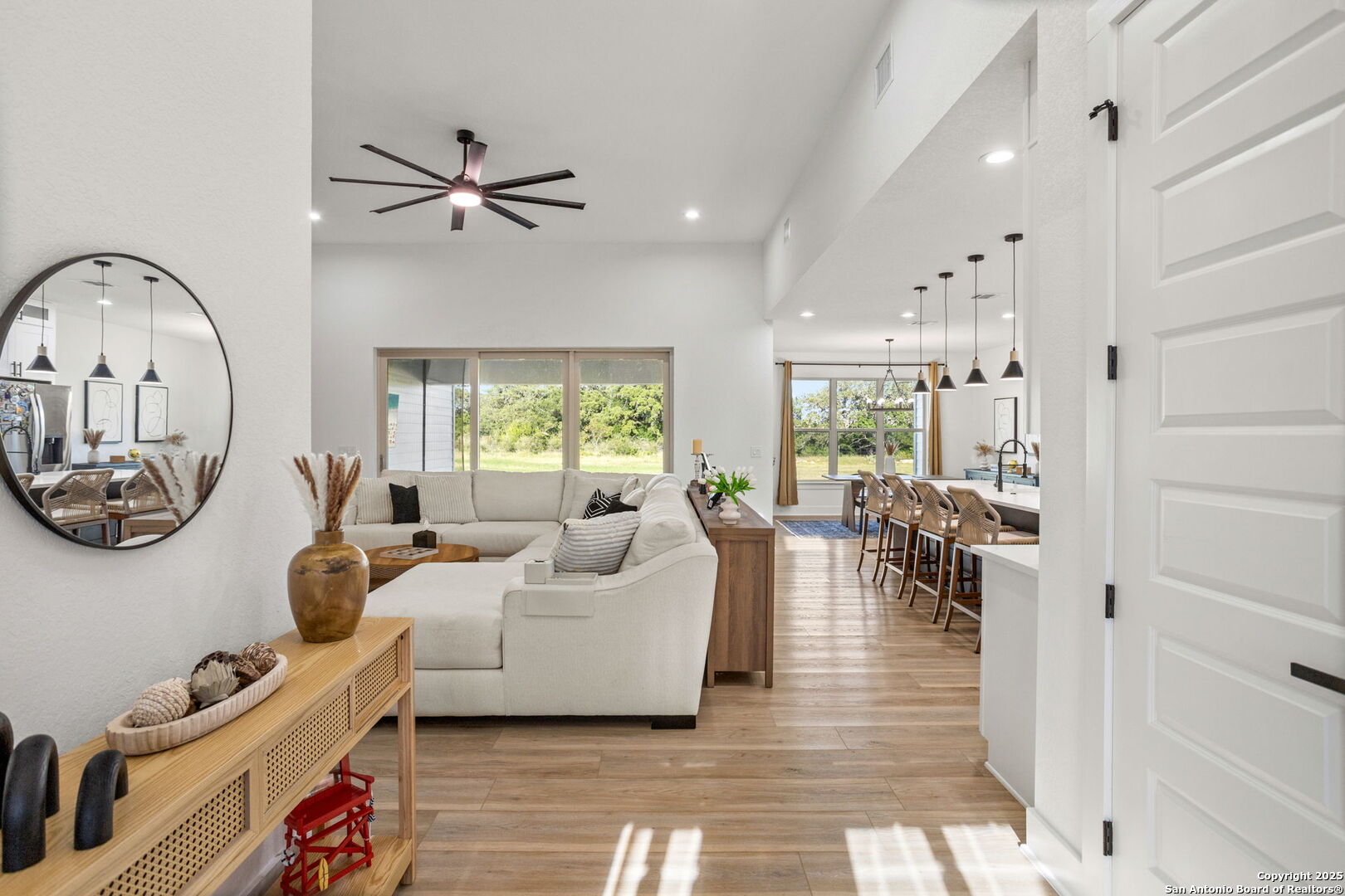 187 Stone Loop Castroville, TX 78009 - Photo 6 of 30 a living room with furniture and a large window