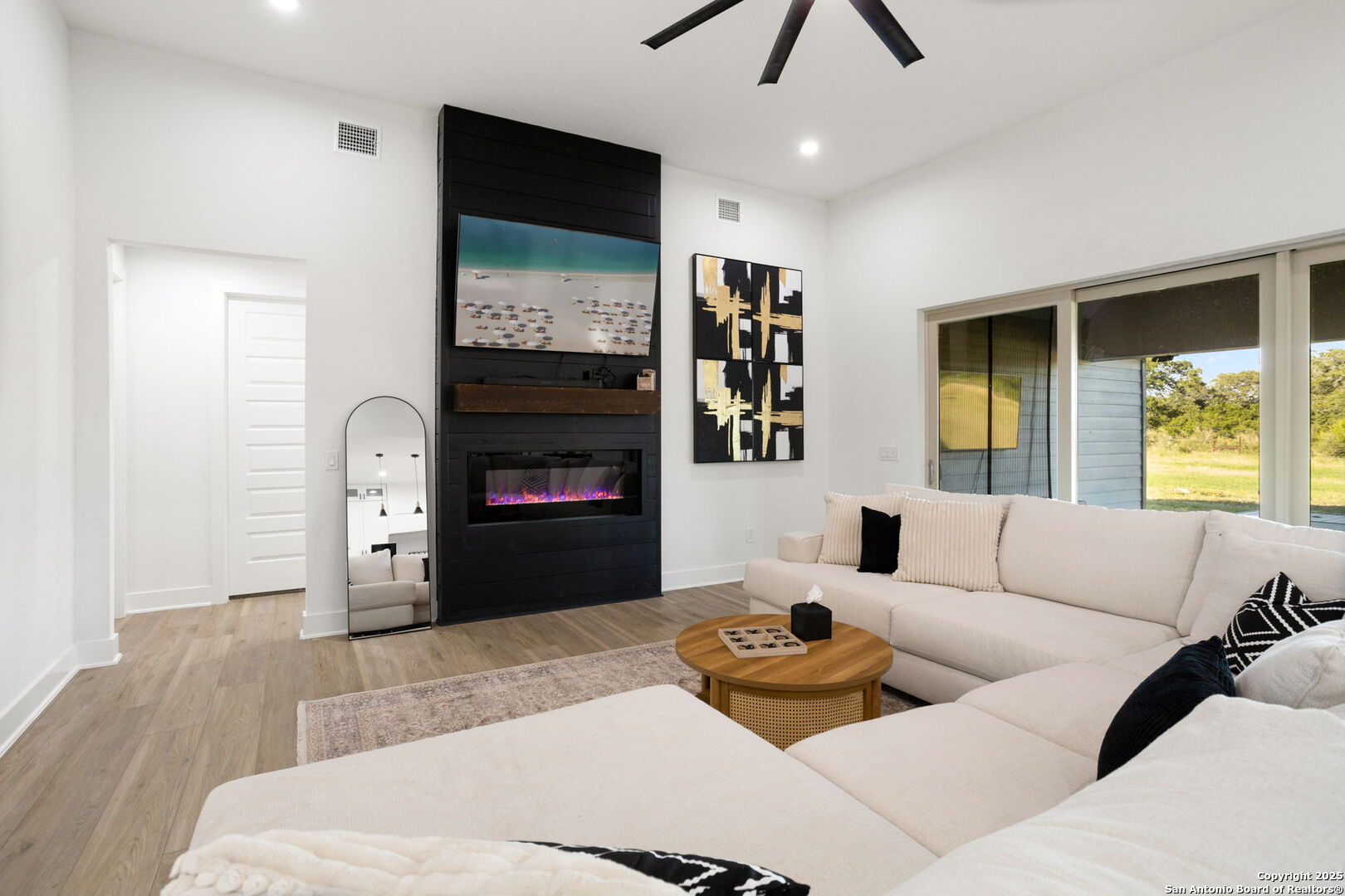 187 Stone Loop Castroville, TX 78009 - Photo 10 of 30 a living room with furniture and a fireplace