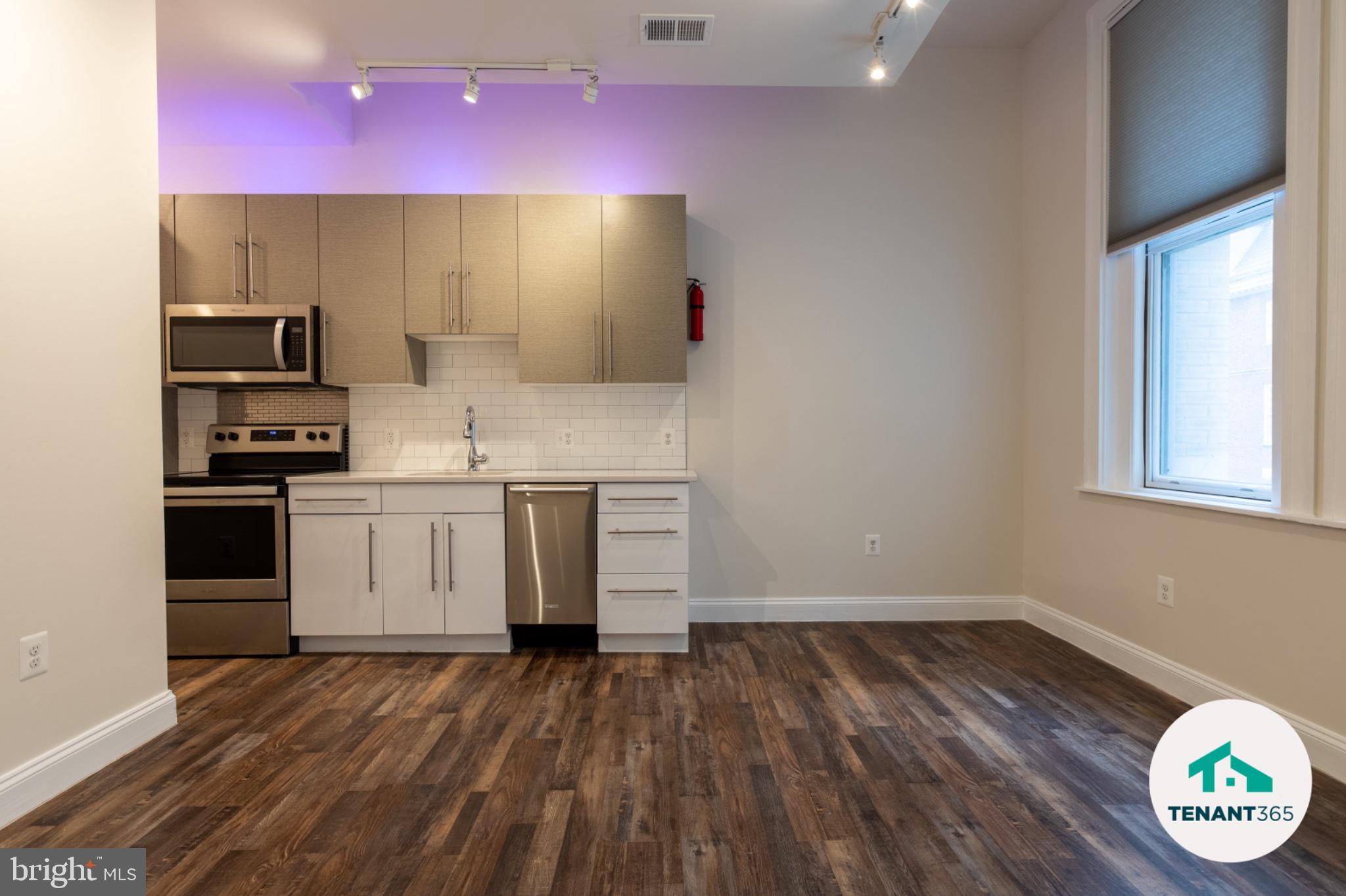8 East Fayette Street, Unit 201 Baltimore, MD 21202 - Photo 11 of 14 Modern kitchen with sleek finishes.
