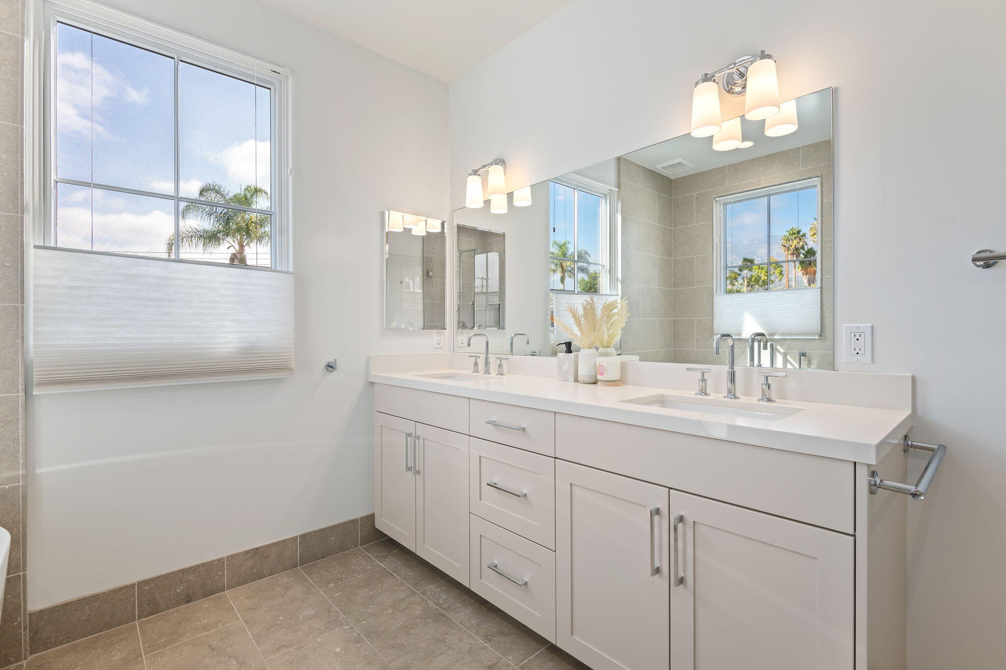 3728 State Street, Unit 136 Santa Barbara, CA 93105 - Photo 13 of 21 a bathroom with a double vanity sink and a mirror