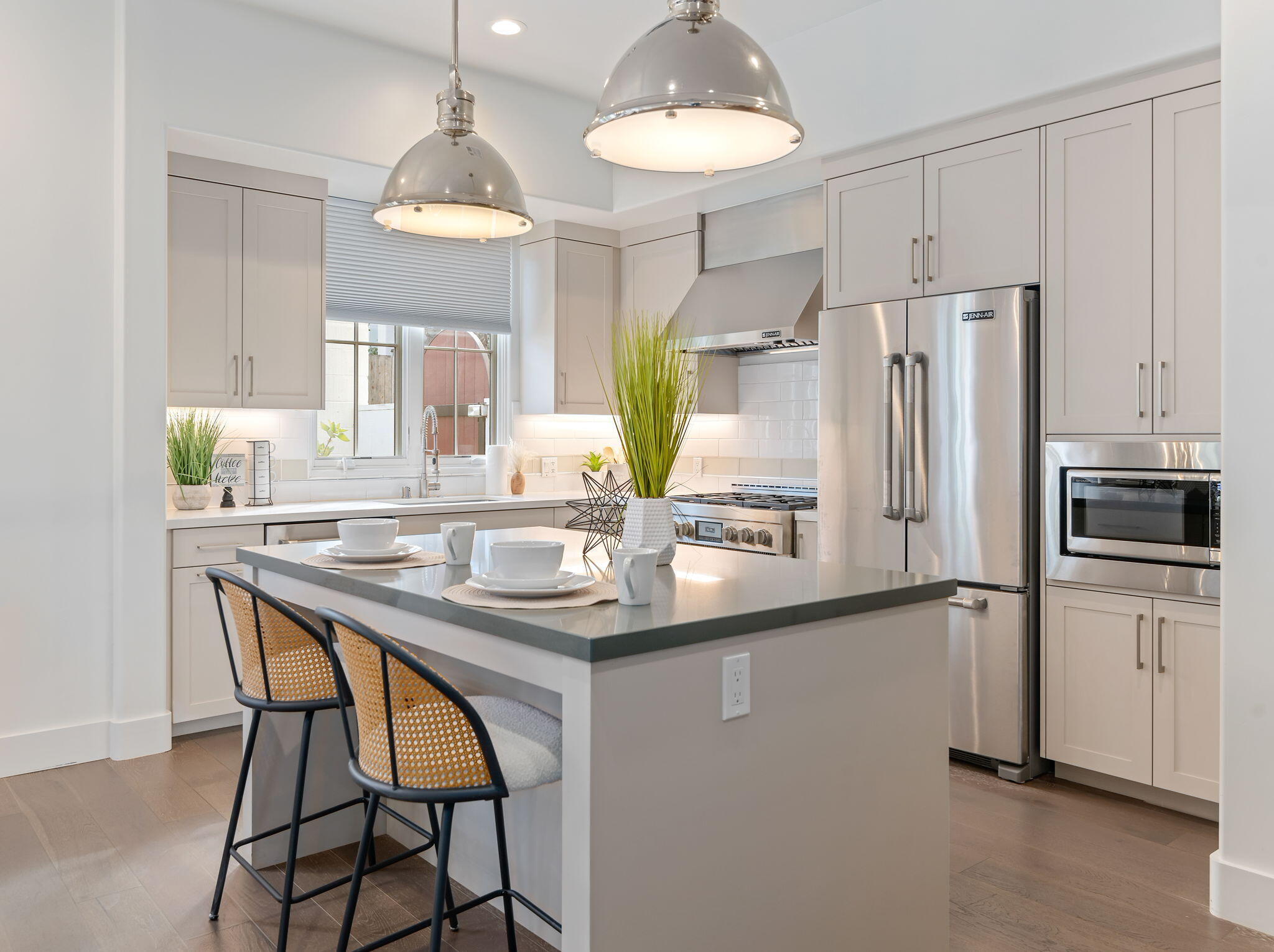 3728 State Street, Unit 136 Santa Barbara, CA 93105 - Photo 6 of 21 a kitchen with stainless steel appliances a table chairs and chandelier