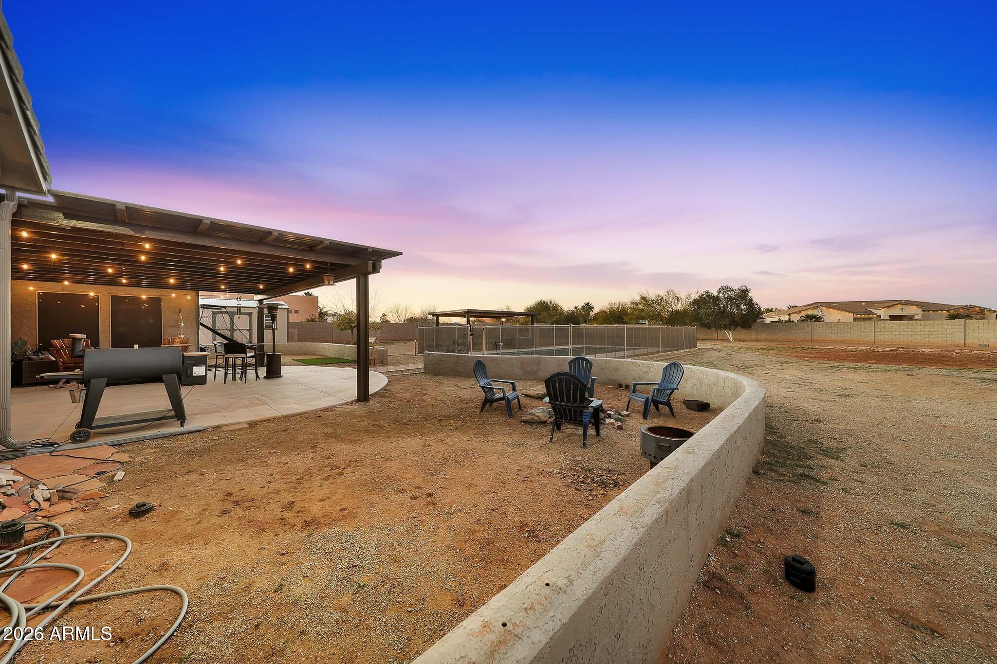 23024 West Sierra Ridge Way Wittmann, AZ 85361 - Photo 88 of 99 a view of a terrace with chairs