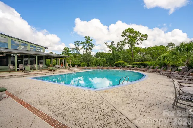 a view of a swimming pool with a patio