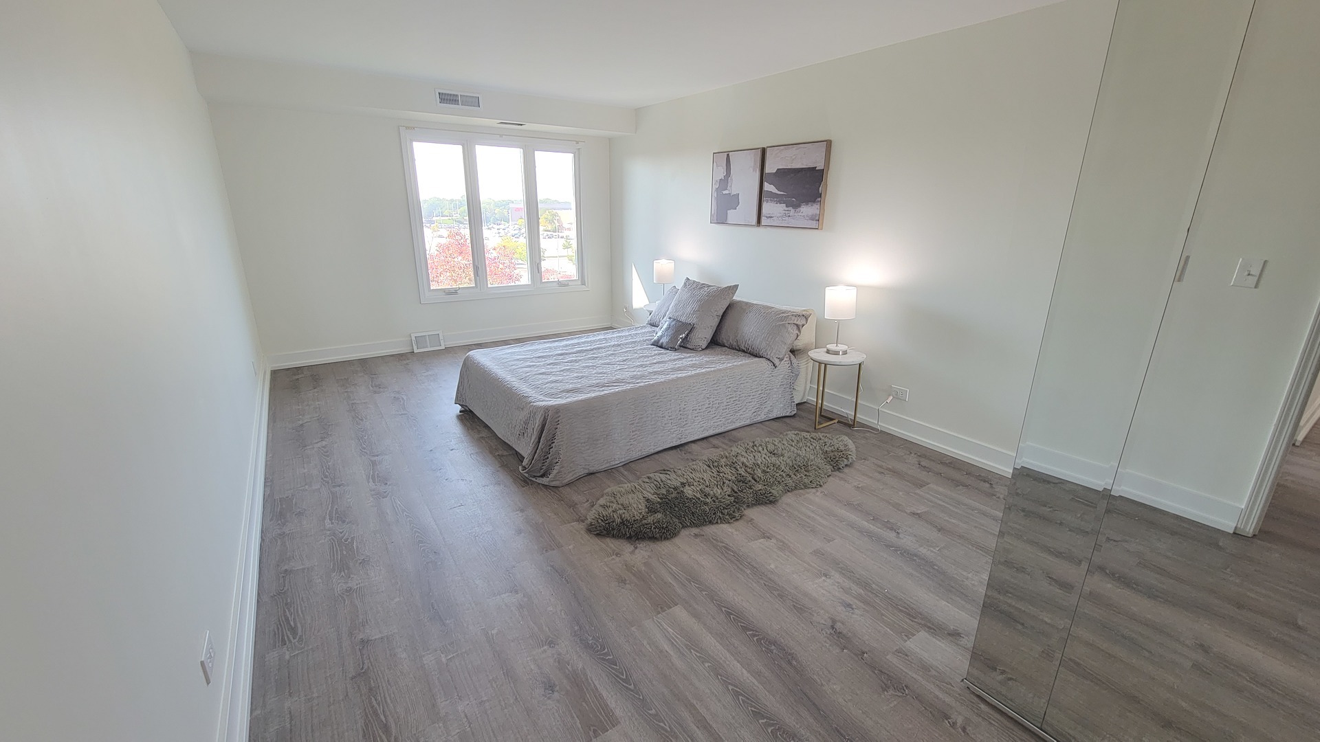 1280 Rudolph Drive, Unit 5E Northbrook, IL 60062 - Photo 11 of 33 a spacious bedroom with a bed and window