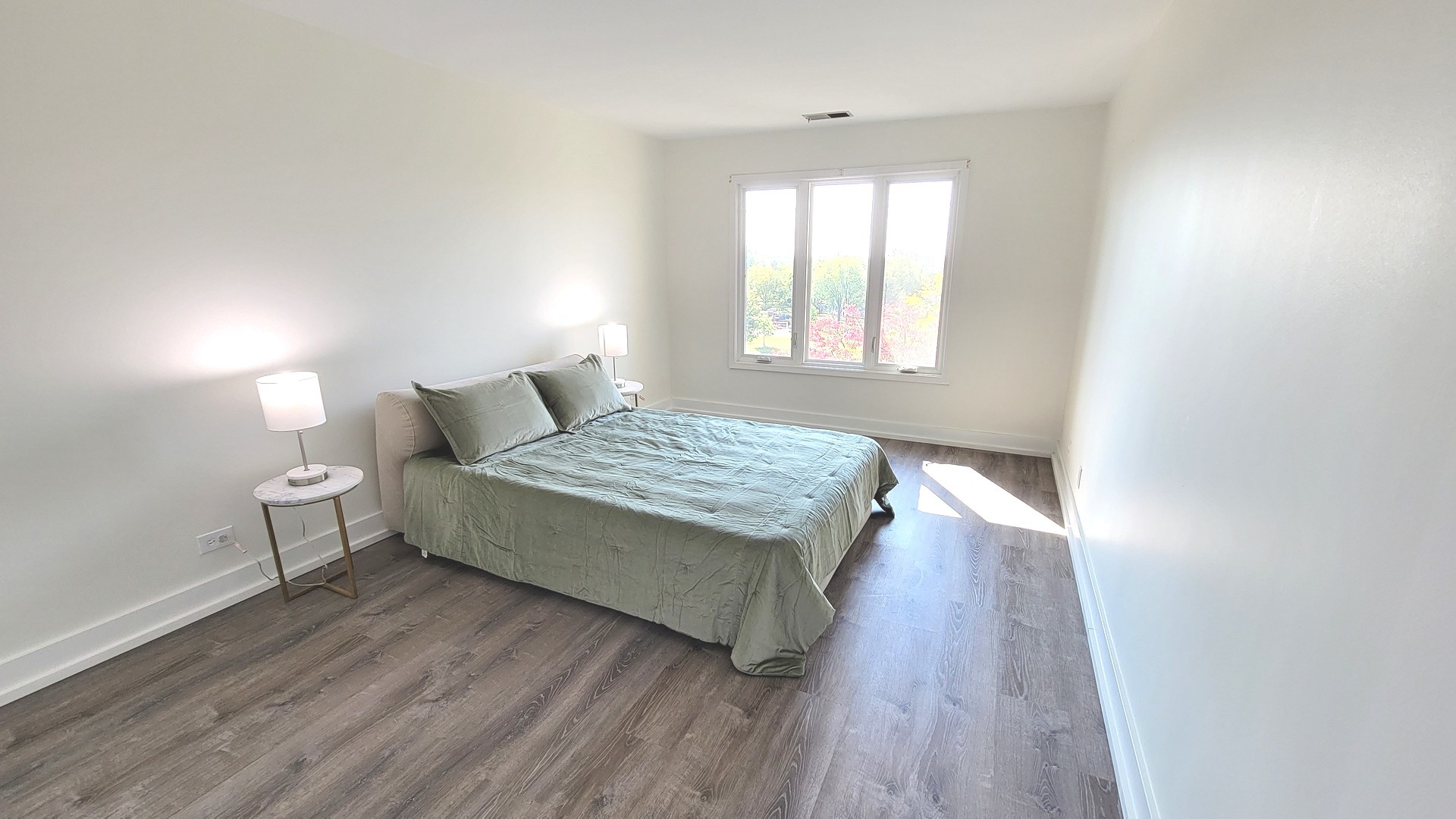1280 Rudolph Drive, Unit 5E Northbrook, IL 60062 - Photo 15 of 33 a bedroom with a bed and window