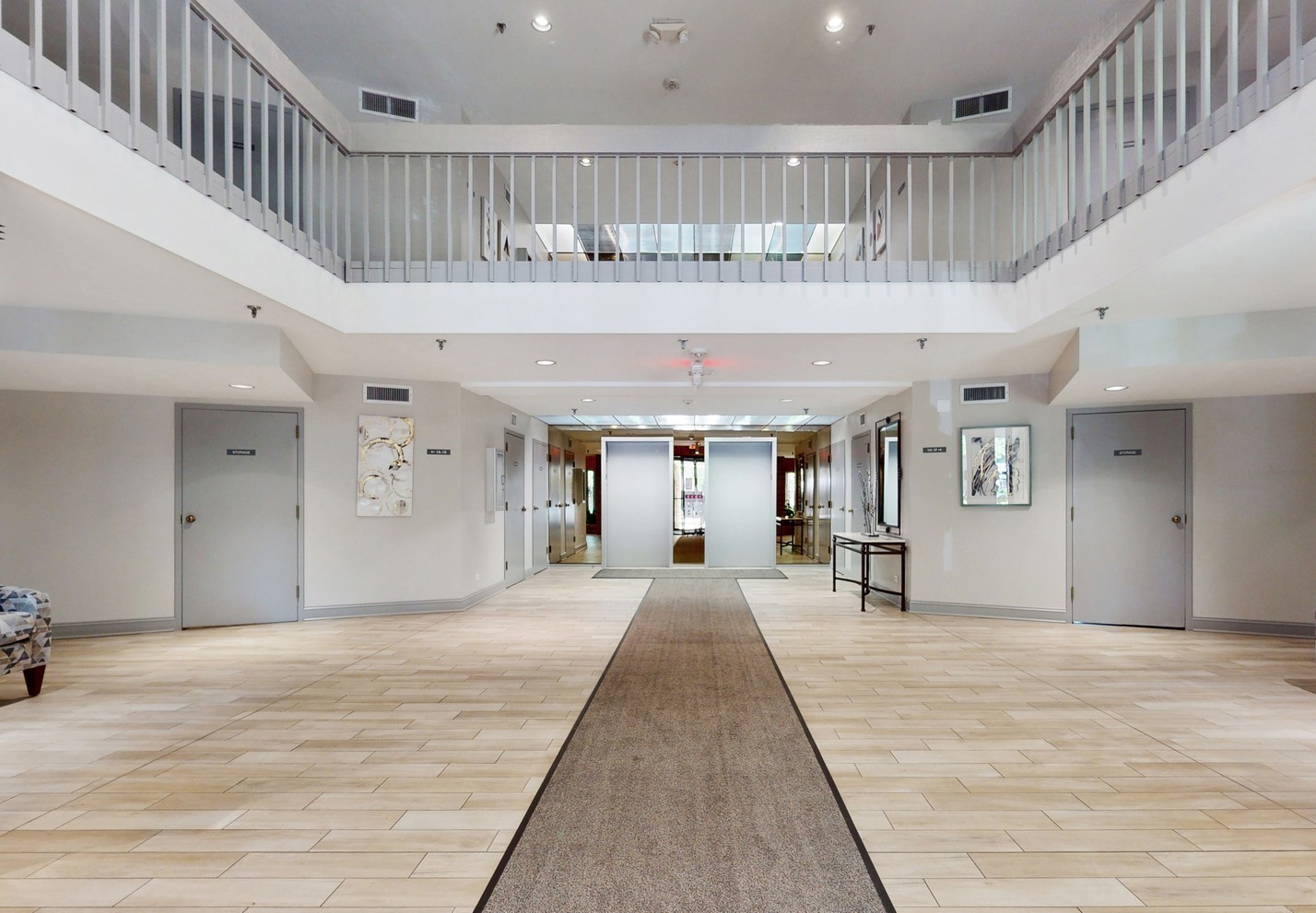 1280 Rudolph Drive, Unit 5E Northbrook, IL 60062 - Photo 2 of 33 a view of a hallway with a large window and chandelier
